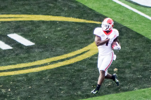 Sony Michel, Photo by Jami430, Rose Bowl 2018 - Sony Michel scores Georgia's first touchdown, CC BY-SA 4.0